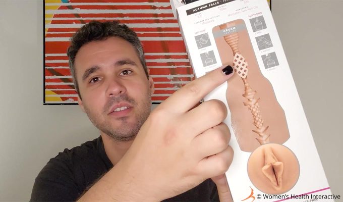 photograph of justin pointing to the waffle texture on the diagram of autumn falls cream fleshlight's box