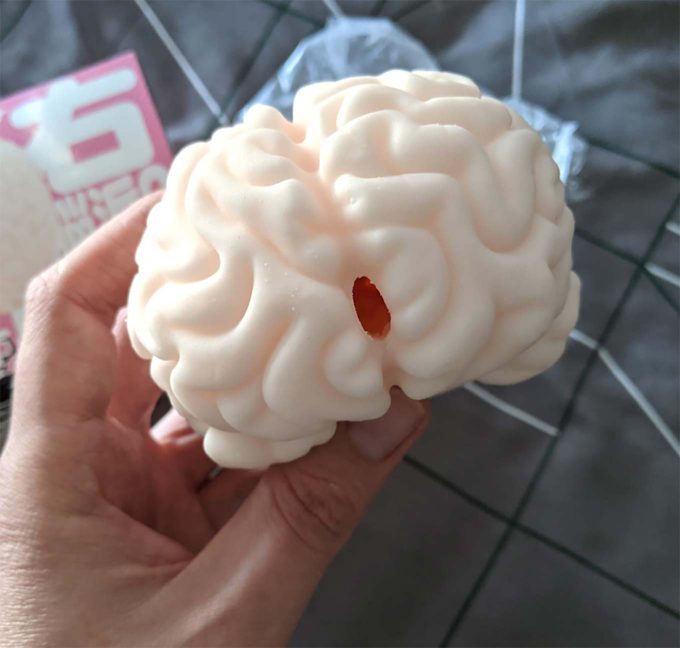 photograph of a brain fleshlight featuring a small orifice for penetration