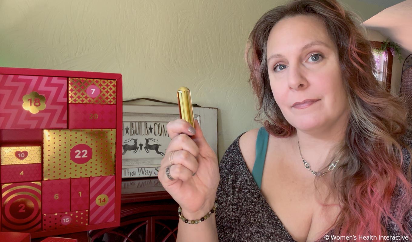 sex toy tester alison holding the bullet vibrator that comes with the 2025 lovehoney advent calendars