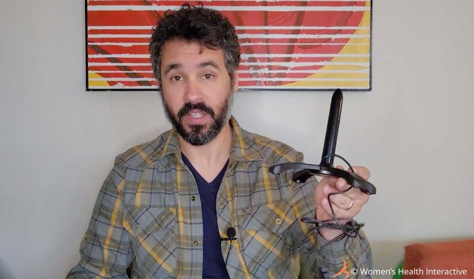 photograph of product tester justin holding the now-discontinued fleshlight quickshot warmer in his hand while talking about the best ways to warm a fleshlight, pocket pussy, male masturbator, or stroker