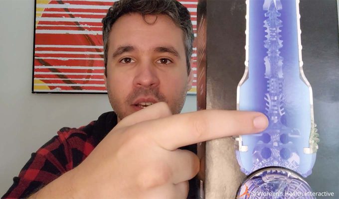 photograph of product tester justin holding the fleshlight turbo core box in his hand while pointing to the texture map on the box