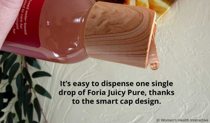 close up photograph of single drop of juicy pure being poured from the cap to demonstrate how easy it is to dispense drop by drop