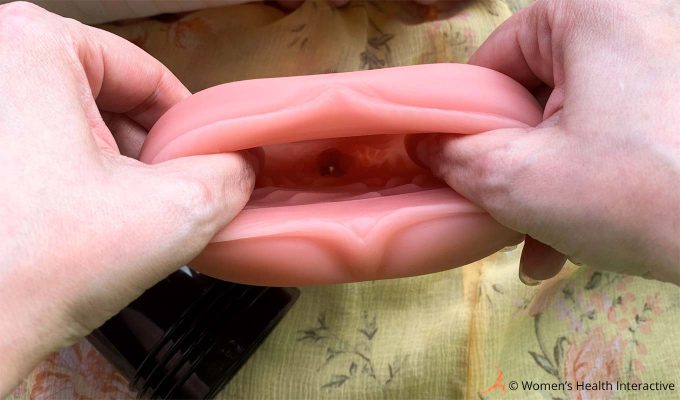 photograph of a fleshlight sleeve being stretched to show some of its inner texture