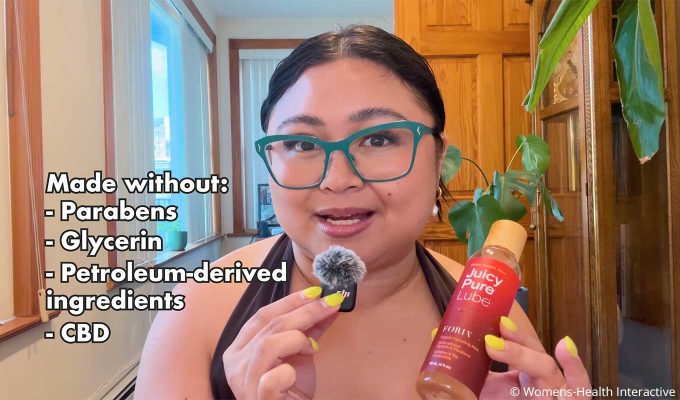 clarisse holding a bottle of juicy pure lube in her hand with text overlay that says it's made without parabens and glycerin