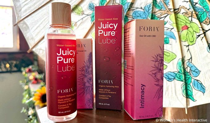 juicy pure lube bottle with its box and other foria products that include their sex oil with cbd and arousal oil