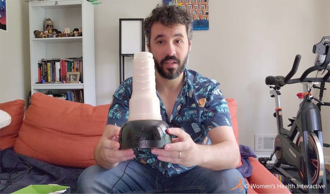 photograph of justin holding the fleshlight air to demonstrate how it works