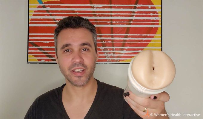 photograph of tester justin holding the mia malkova boss level anal pornstar fleshlight with the orifice pointed toward the viewer to display the very small and tight opening