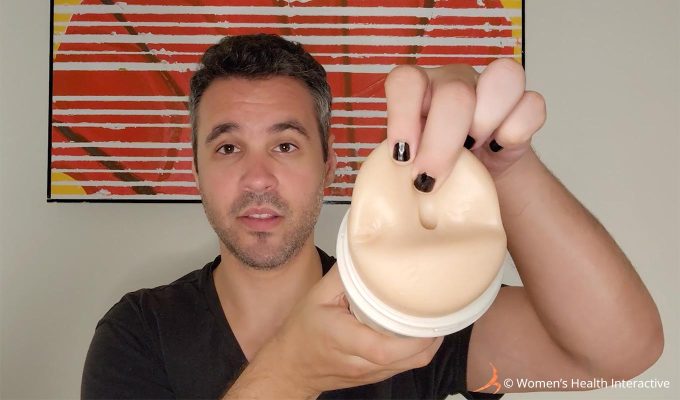 photograph of tester justin holding the celebrity pornstar mia malkova boss level anal fleshlight girl model while stretching the orifice slightly to display its tightness