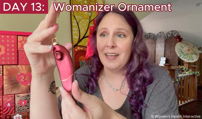 product tester alison holding the womanizer ornament that came in the 2026 couples calendar from lovehoney