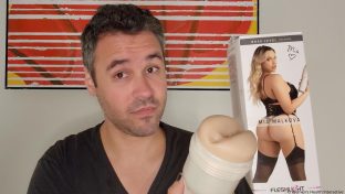 photograph of tester justin holding up the mia malkova boss level anal pornstar fleshlight in his hand alongside its box which features a photograph of the model and her butt
