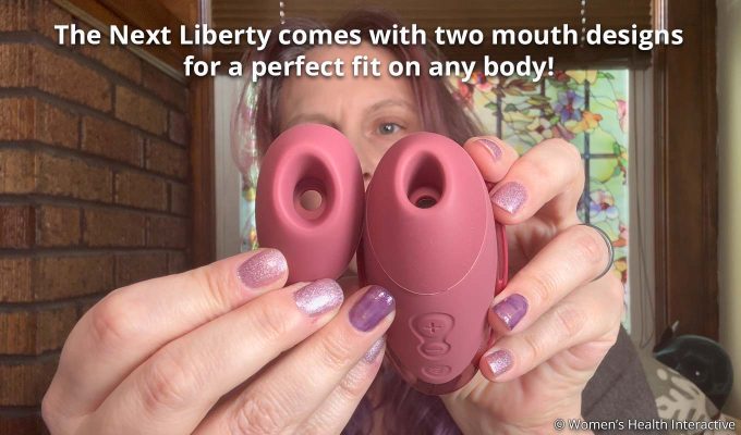 product tester alison holding up the womanizer next liberty and the extra mouth attachment to show the difference in size and shape