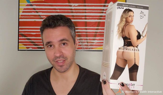 photograph of tester justin holding the mia malkova boss level anal fleshlight girl box in his hand while smiling