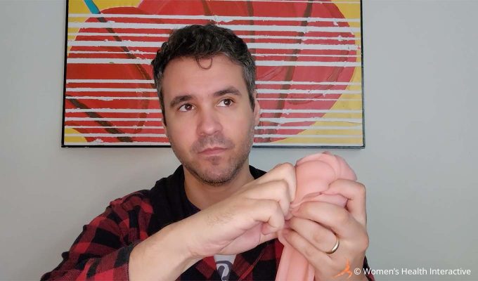 photograph of product tester justin struggling with the bullet vibrators inserted into the fleshlight vibro lady sleeve