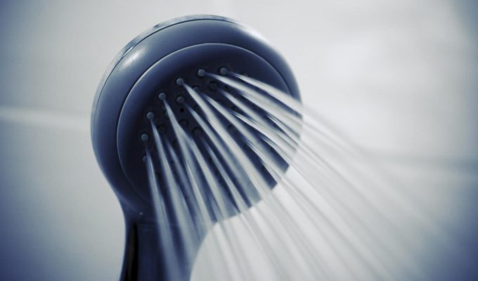 Close Up Photograph Of Running Water From Detachable Showerhead