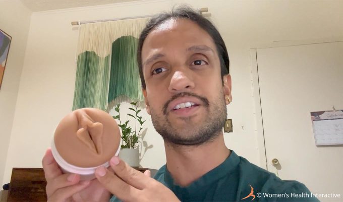 photograph of fleshlight tester david holding the autumn falls cream fleshlight while pointing toward the orifice