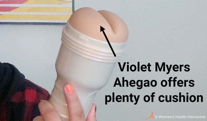 close up photograph of the violet myers fleshlight ahegao with text overlay that reads: violet myers ahegao offers plenty of cushion, with an arrow pointing toward the extra padding around the orifice