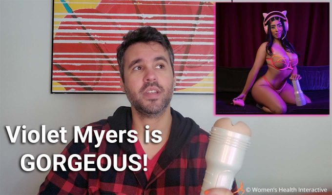 collage image featuring a photograph of product tester justin holding the violet myers anal ahegao fleshlight in one hand while looking upward, where an inset image of the pornstar is, with text overlay that reads: violet myers is gorgeous