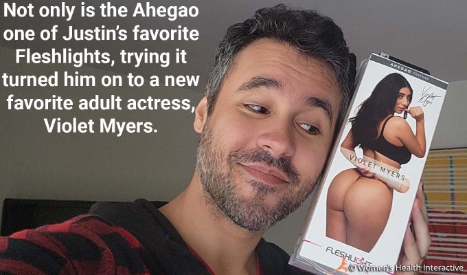 photograph of product tester justin smiling while leaning his head against the violet myers fleshlight ahegao box with text overlay that reads: not only is the ahegao one of justin's favorite fleshlights, trying it turned him on to a new favorite adult actress, violet myers