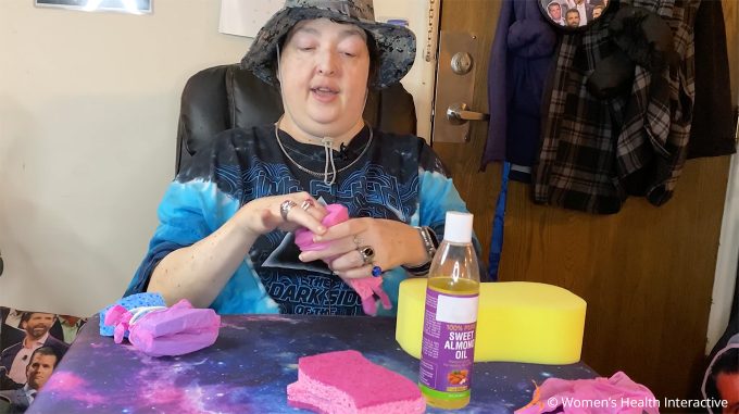 photograph of wednesday holding diy sponge fleshlight after adding rubber bands