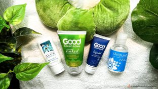 photograph of four water-based lubricants on a soft furry blanket: aloe cadabra, good clean love almost naked and liquid, and sliquid h20