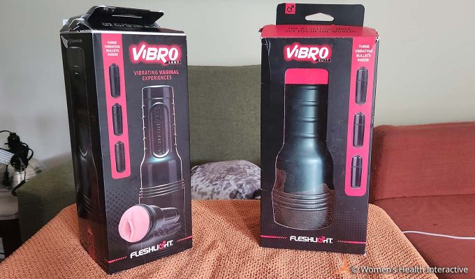 photograph of the boxes for the fleshlight vibro lady and fleshlight vibro butt vibrating pocket pussies and strokers on a table top together