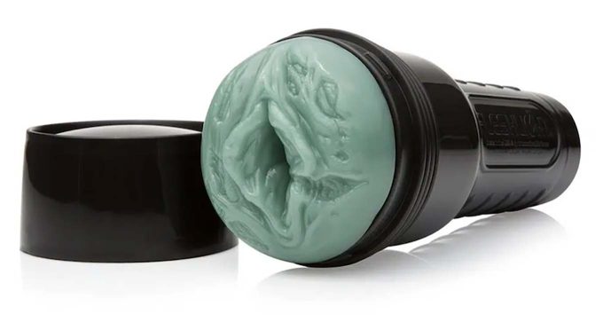 photograph of a fleshlight featuring green, mottled zombie skin, part of the company's freaks line
